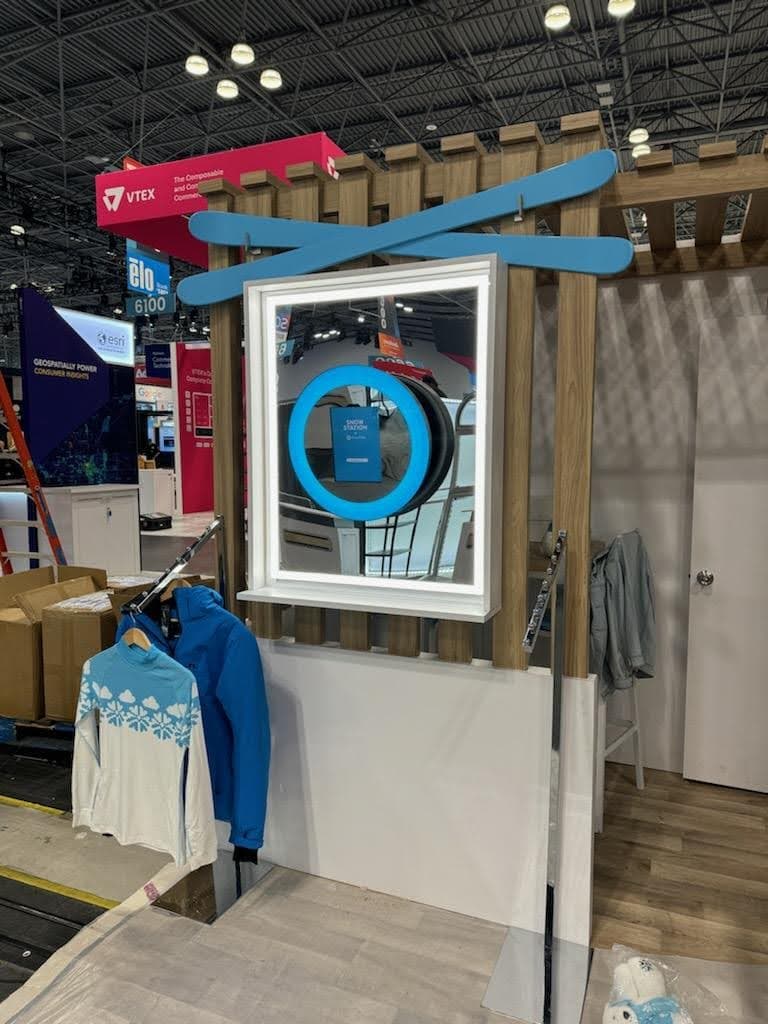 Trade show booth with photo booth generating crowd engagement
